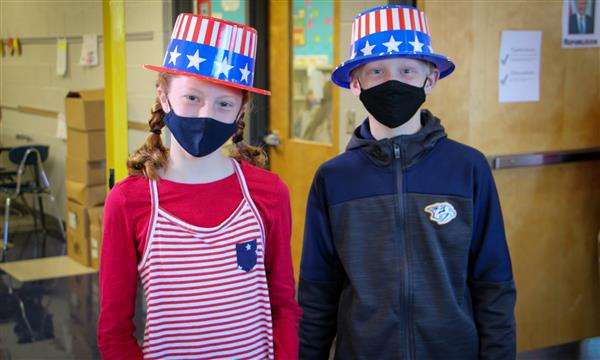 Two students dressed as voting volunteers